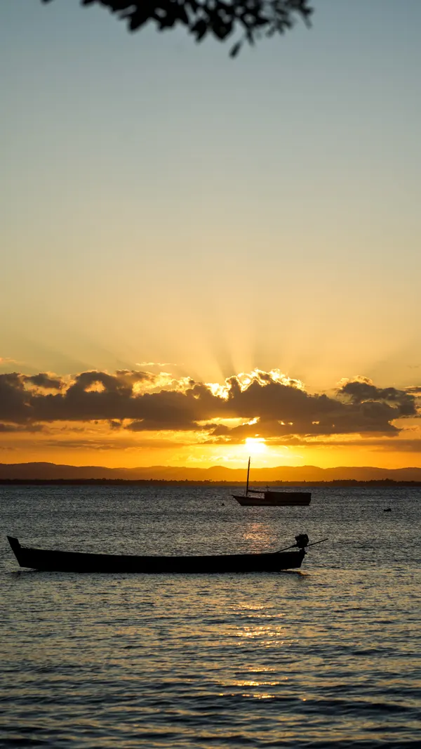 A boat at anchor at sunset, on the Maraú Peninsula